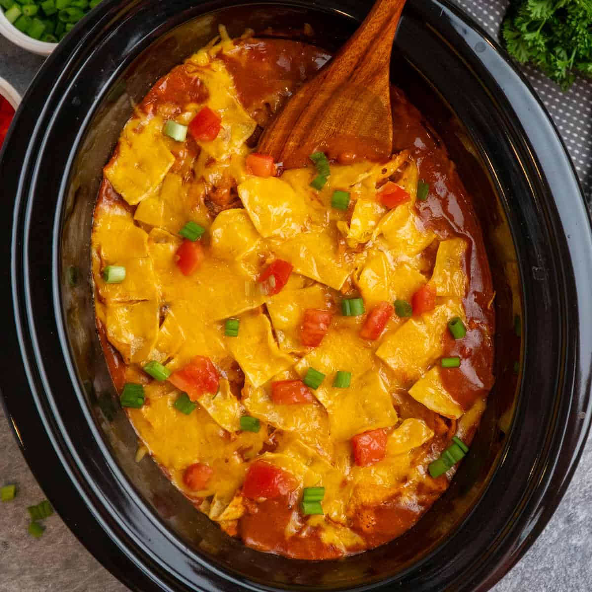 No Rolling: Cheesy Slow Cooker Chicken Enchilada Casserole